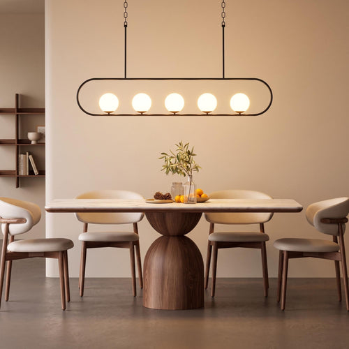 Handmade 5-light linear globe chandelier in black-gold powder coated finish with matte white glass globes for dining tables and kitchen islands.