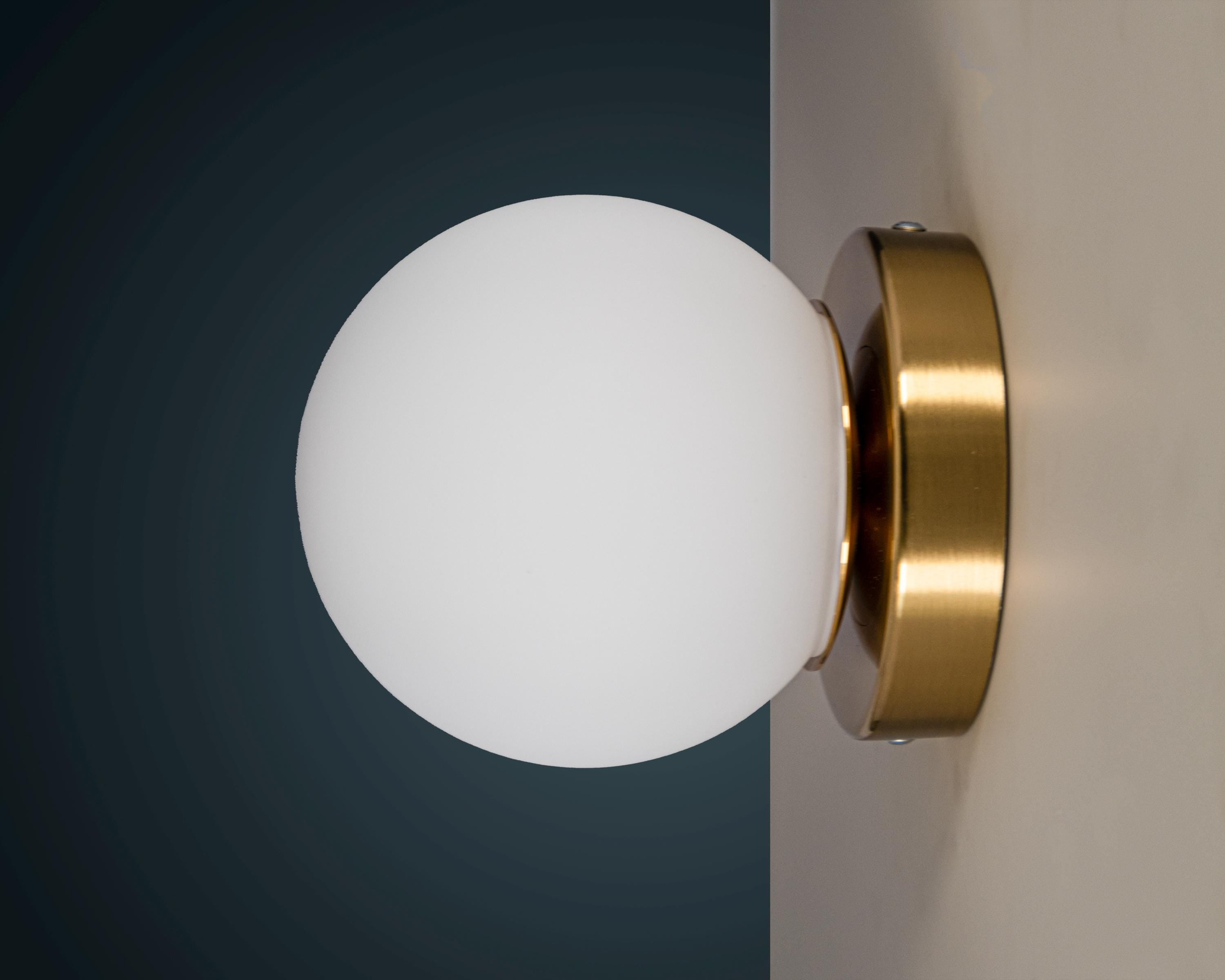 Opal Glass Globe Wall Sconce: Mid-Century Modern Brass Vanity Light