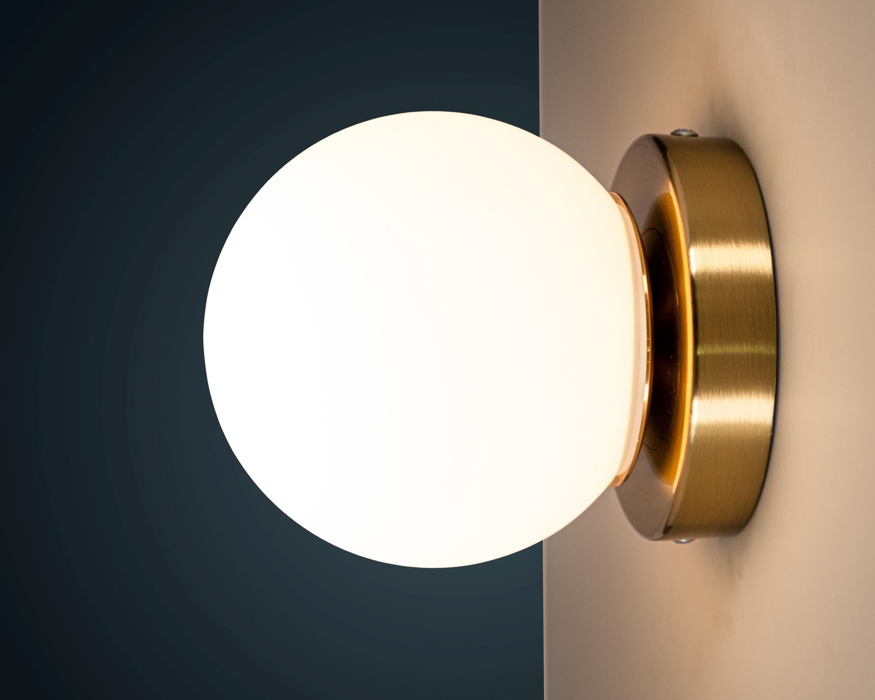 Opal Glass Globe Wall Sconce: Mid-Century Modern Brass Vanity Light