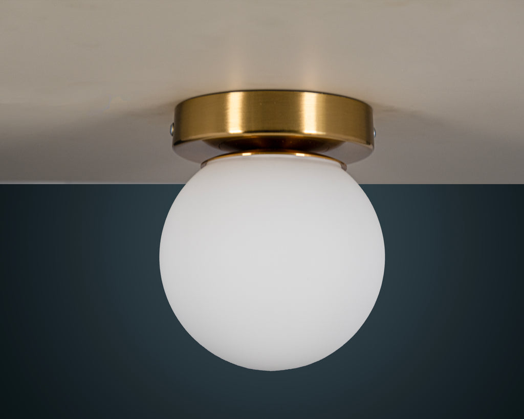Opal Glass Globe Wall Sconce: Mid-Century Modern Brass Vanity Light